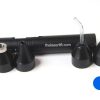 A set of black plastic plugs and a tube.