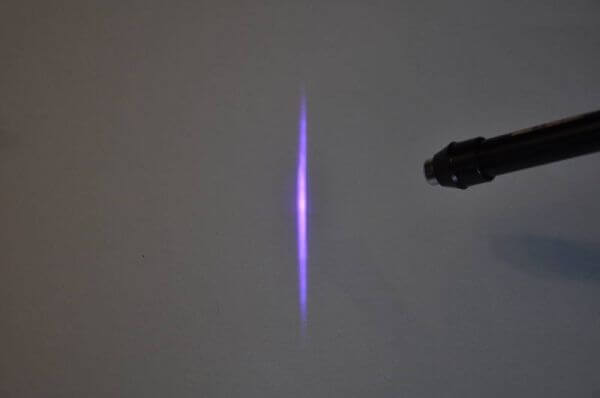A purple light is seen in the sky.